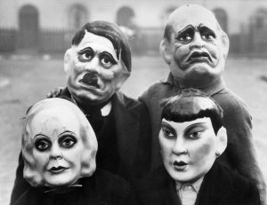 A group of children in London, wearing war-era Halloween masks, 1940s.