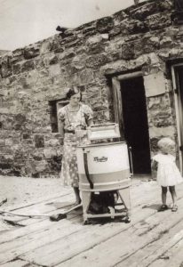 A woman with her new Maytag washing machine, Windy Point Texas, 1934.