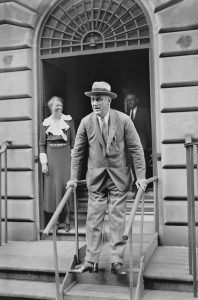 President Roosevelt and his supportive wife Eleanor behind him, 1933.