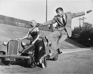Hollywood icons Marilyn Monroe and Sammy Davis Jr. on a film set, 1953.