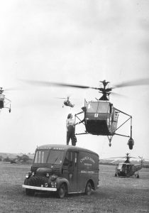 A canteen worker served tea to the pilot of Sikorsky R-4, 1945.