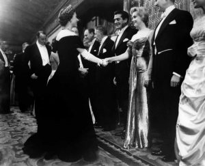 A youthful Queen Elizabeth 2nd greeted screen siren Marilyn Monroe, 1956.
